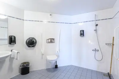 a bathroom with a shower and a toilet and a sink at De Rijper Eilanden in De Rijp
