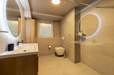 a bathroom with a sink and a toilet at Midtown Hotel Royal Room in Amsterdam