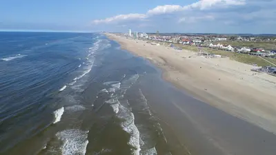 an aerial view of a beach with people on it at Costa in Zandvoort
