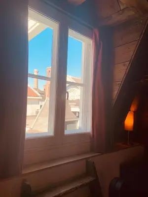 a window in a room with a view of a building at Amsterdam Central Guest House in Amsterdam
