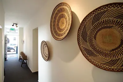 a hallway with two plates on the wall at Hotel Zand in Zandvoort