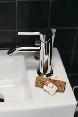 a coffee maker sitting on top of a sink at Hotel Zand in Zandvoort