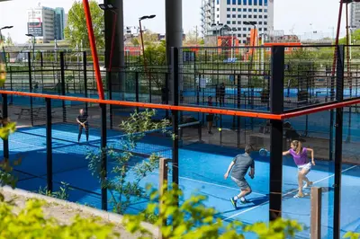 a group of people playing on a trampoline at Holiday Inn Express Amsterdam - Sloterdijk Station by IHG in Amsterdam