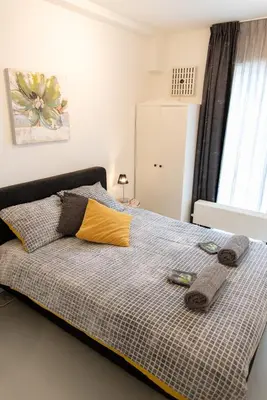 a bedroom with a bed with two towels on it at Excellent 21 in Soesterberg