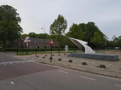 a sculpture in a parking lot next to a street at Excellent 21 in Soesterberg
