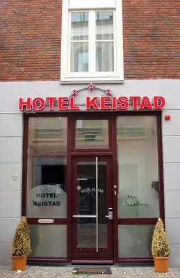 a hotel k reset sign in front of a building at Hotel Keistad in Amersfoort