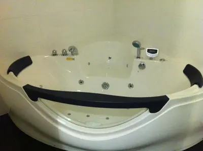 a bath tub with a face painted on it at Alex Rooms in Zwanenburg