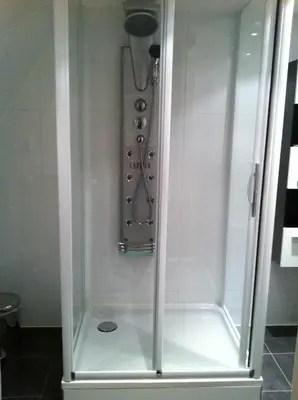 a shower with a glass enclosure in a bathroom at Alex Rooms in Zwanenburg