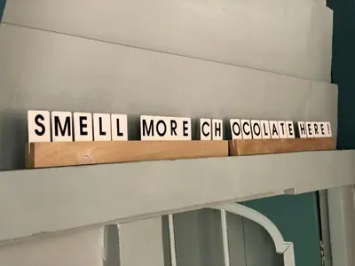 a sign that saysmean more caleb coordinate herself on a shelf at Boutique Hotel Zaan in Zaandijk