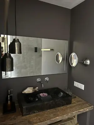 a bathroom with a black sink and a mirror at Chill-out in Nieuwe Wetering