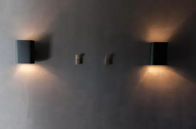 a wall with two lights on a wall at Chill-out in Nieuwe Wetering