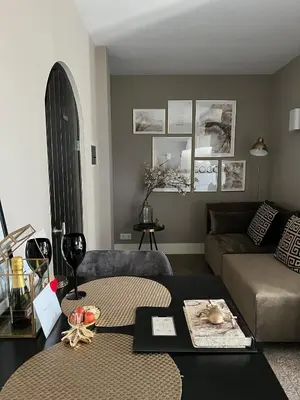 a living room with a couch and a table at Chill-out in Nieuwe Wetering