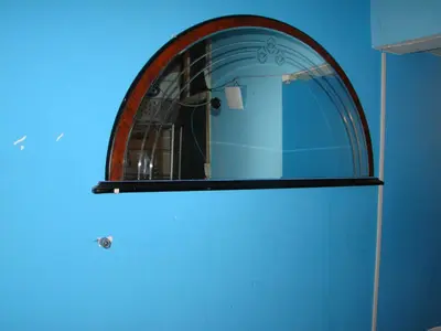 a bathroom with a mirror and a blue wall at Amsterhouse B&B in Amsterdam