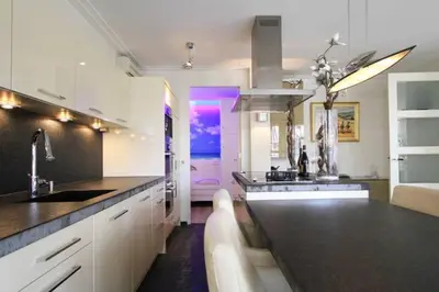 a kitchen with a sink and a counter top at Appartement Volendam in Volendam