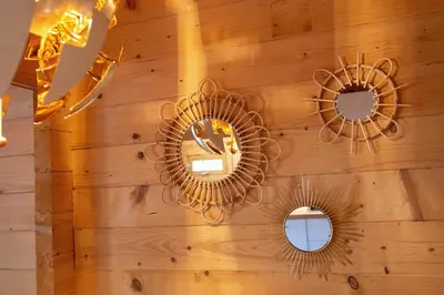a wall with two mirrors and mirrors on it at The Sea Lodge in Zandvoort