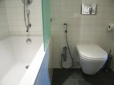 a bathroom with a toilet and a tub and a shower at Amsterdam Canal Guest Apartment in Amsterdam