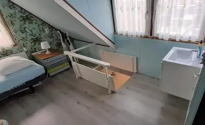 a small room with a bed and a sink at Close to the beach in Wijk aan Zee