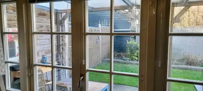 an open window looking out onto a yard at Close to the beach in Wijk aan Zee