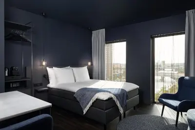 a hotel room with a bed and a window at Van der Valk Hotel Amsterdam - Amstel in Amsterdam