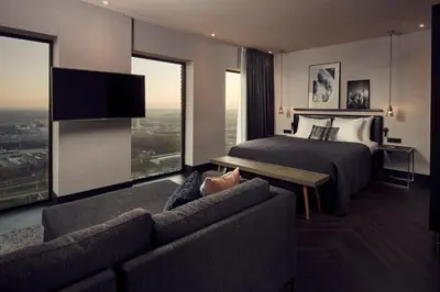 a hotel room with a bed and a couch at Van der Valk Hotel Amsterdam - Amstel in Amsterdam