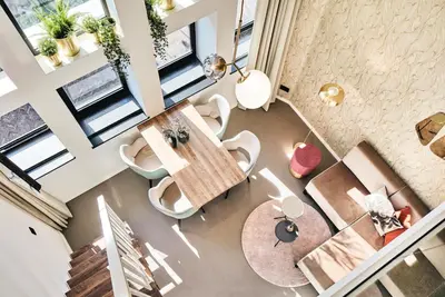 an overhead view of a living room with a table and chairs at The Anthony in Utrecht