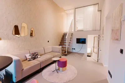 a living room with a couch and a table at The Anthony in Utrecht