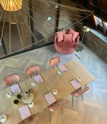 an overhead view of a dining room table and chairs at The Anthony in Utrecht