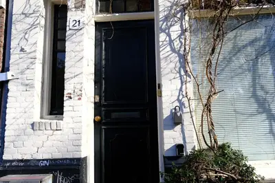 a black door on the side of a building at Studio Eelhouse in Amsterdam