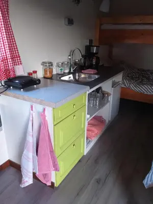 a kitchen with a sink and a counter at Bed & Breakfast ARKEN AE in Zuiderwoude