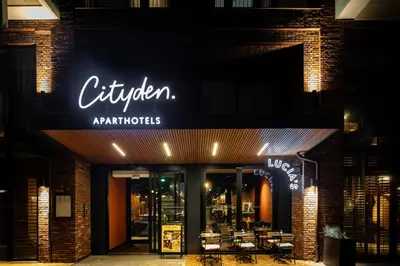 a restaurant with a sign on the front of a building at Cityden Stadshart in Amstelveen