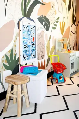 a toy room with a stool and a table at Cityden Stadshart in Amstelveen