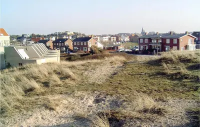 a view of a town with houses on a hill at De Vissende Beer in Egmond aan Zee