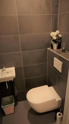 a bathroom with a toilet and a sink at Studio Black Jack in Amsterdam