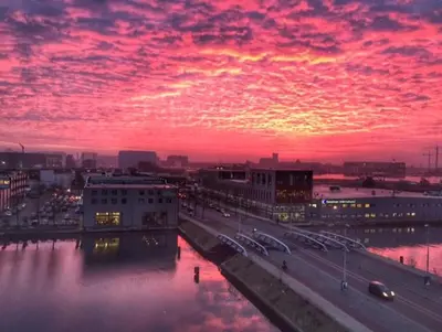 a sunset over a city with a body of water at Studio Black Jack in Amsterdam