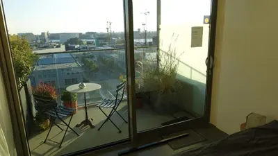 a view of a balcony with a table and chairs at Studio Black Jack in Amsterdam