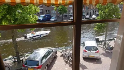 a view from a window of a boat in the water at Boutique Hotel Huys van Leyden in Leiden