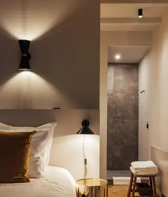 a bedroom with a bed and a glass shower at Suite no 7, hidden gem center of Amsterdam in Amsterdam