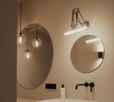 a bathroom with two mirrors and a sink at Suite no 7, hidden gem center of Amsterdam in Amsterdam