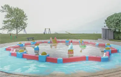 a water park with a playground with a water slide at Markermeerzicht in Bovenkarspel