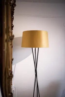 a lamp sitting next to a wall next to a mirror at Cozy Pijp Apartment Amsterdam in Amsterdam
