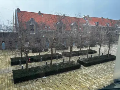 a group of trees in front of a building at Hotel Oostereiland in Hoorn