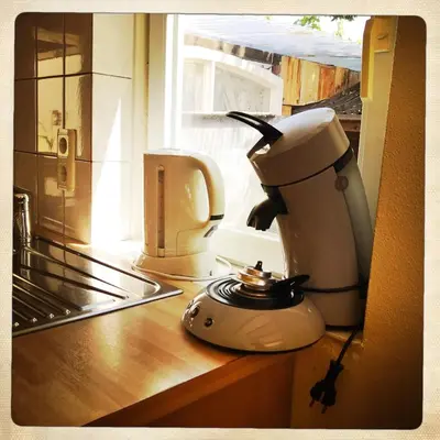 a coffee maker sitting on a counter in a kitchen at De Munnik in Camperduin