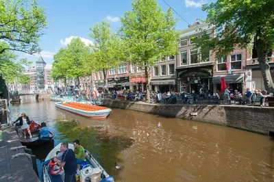 a group of people in a boat on a river at CASASdeCASPER - Studio Alkmaar in Alkmaar