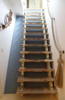 a staircase made out of wood with rope at de Ark in Schoorl