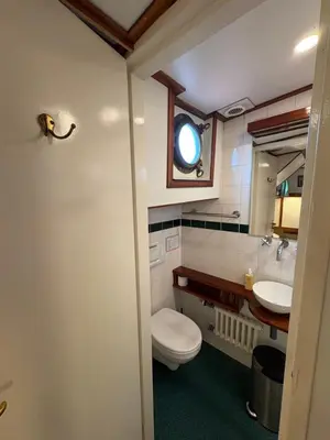 a bathroom with a toilet and a sink at Hotelboot Zwaan in Amsterdam