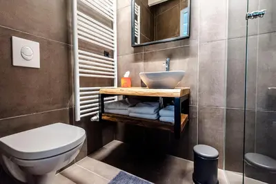 a bathroom with a sink and a toilet at Zandvoort Lodge in Zandvoort