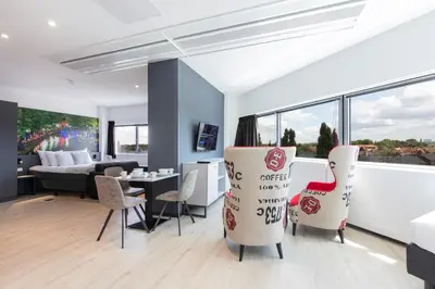 a living room with chairs and a dining room at 2L De Blend in Utrecht