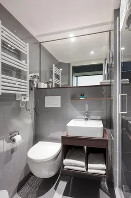 a bathroom with a white sink and a toilet at 2L De Blend in Utrecht