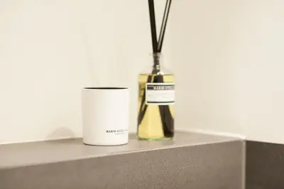 a vase and a can sitting on a counter at Milkhouse Luxury Stay Amsterdam in Amsterdam