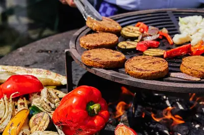 a grill with a bunch of food on it at Postillion Hotel Amsterdam in Amsterdam